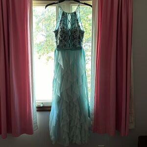 Worn once halter neck prom dress. Color: blue
